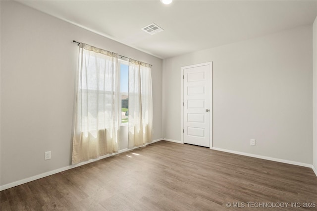 29327 E 80th St SE, Broken Arrow, OK 74014 - unfurnished room featuring visible vents, baseboards, and wood finished floors