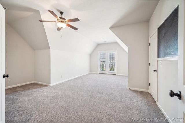 bonus room featuring baseboards, carpet, a ceiling fan, and lofted ceiling
