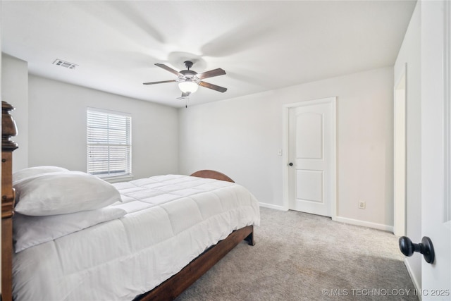 carpeted bedroom with baseboards, ceiling fan, and visible vents