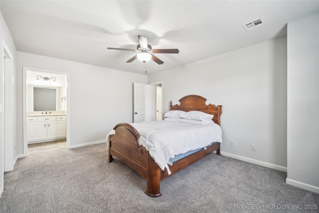 bedroom with baseboards, light colored carpet, and visible vents