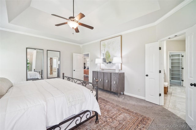 bedroom with carpet flooring, crown molding, baseboards, and ceiling fan