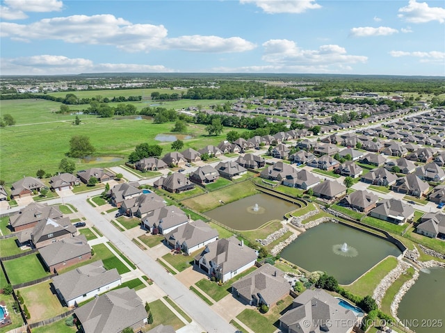 aerial view with a residential view and a water view