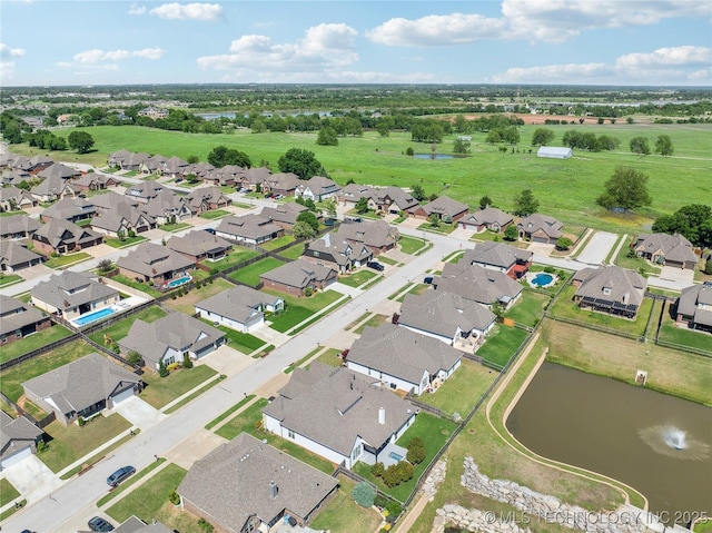 aerial view with a water view and a residential view