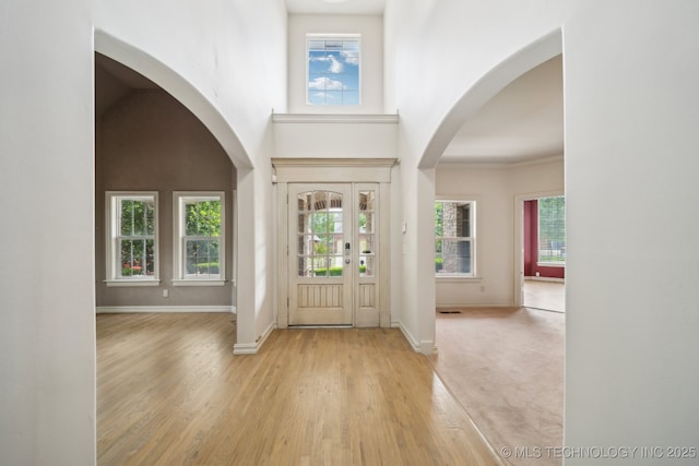 8655 E 103rd St, Tulsa, OK 74133 - foyer with plenty of natural light, wood finished floors, baseboards, and a towering ceiling