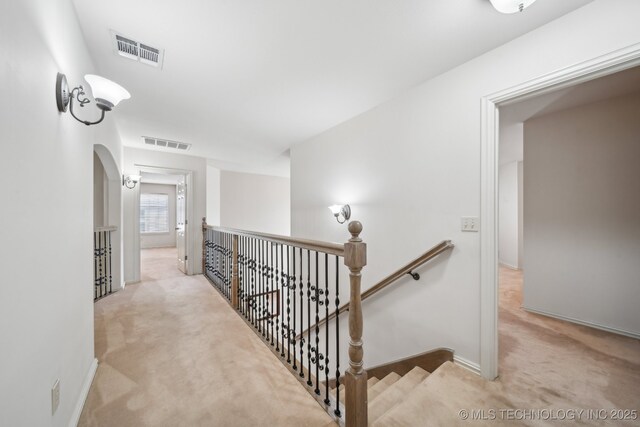 8655 E 103rd St, Tulsa, OK 74133 - corridor featuring an upstairs landing, carpet flooring, and baseboards