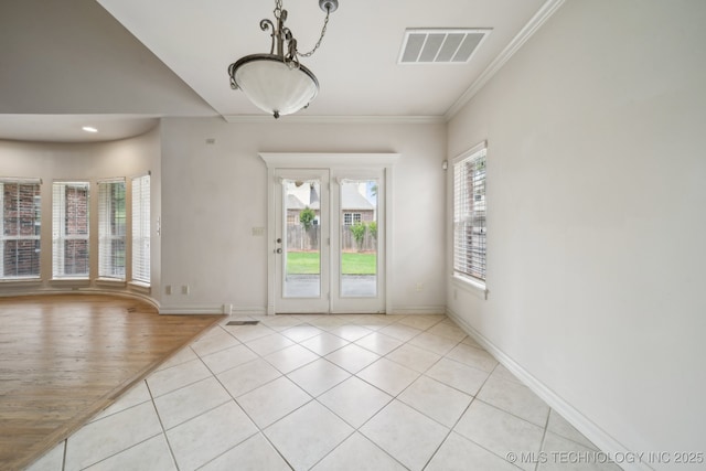 8655 E 103rd St, Tulsa, OK 74133 - spare room with light tile patterned floors, crown molding, and baseboards