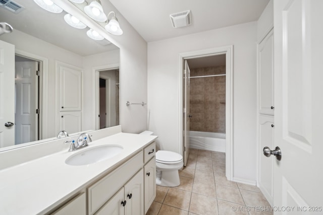 8655 E 103rd St, Tulsa, OK 74133 - bathroom with tile patterned flooring, toilet, vanity, and washtub / shower combination
