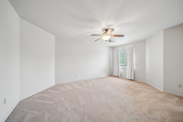 8655 E 103rd St, Tulsa, OK 74133 - carpeted empty room with a ceiling fan and baseboards