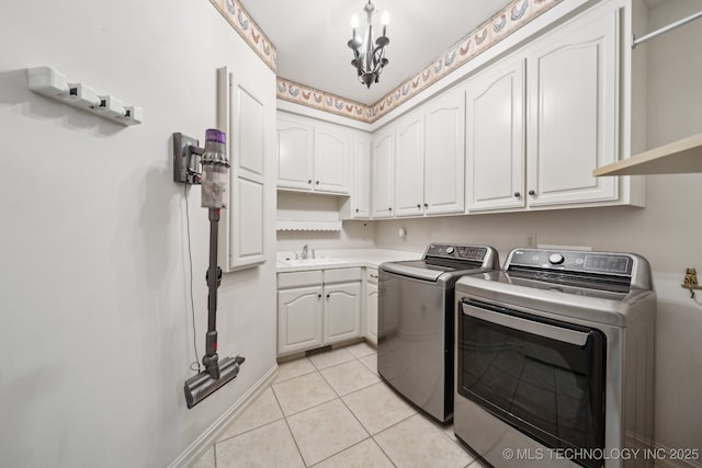 8655 E 103rd St, Tulsa, OK 74133 - washroom with washer and clothes dryer, cabinet space, and light tile patterned floors