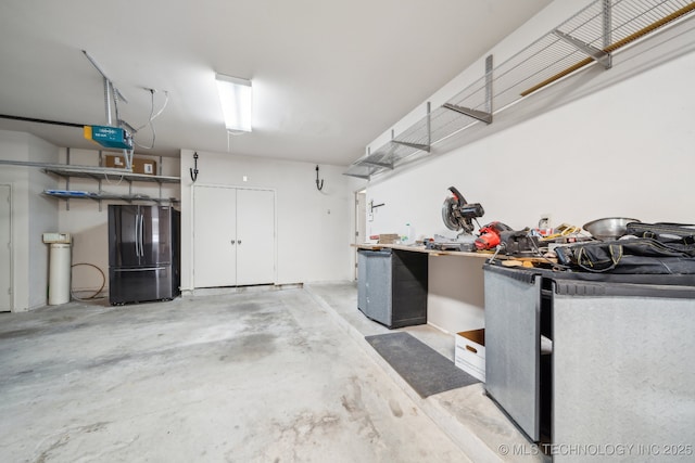 8655 E 103rd St, Tulsa, OK 74133 - garage featuring freestanding refrigerator