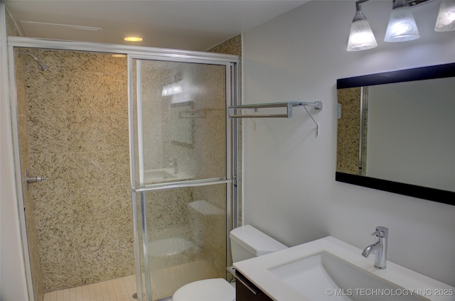 full bathroom with vanity, recessed lighting, a stall shower, and toilet