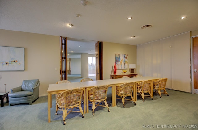 carpeted dining room featuring recessed lighting and visible vents
