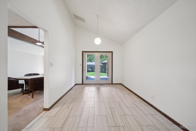 interior space with a textured ceiling, high vaulted ceiling, french doors, baseboards, and visible vents