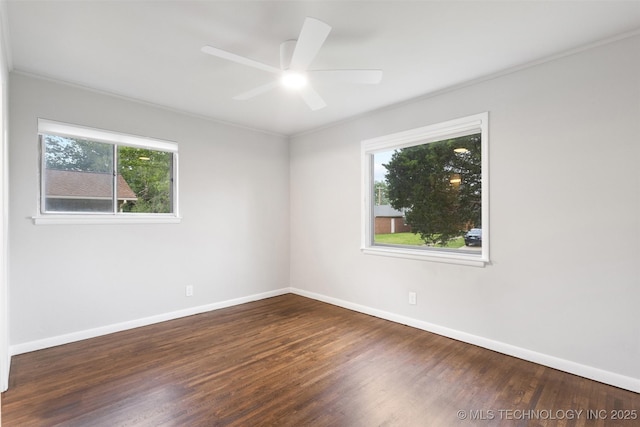 unfurnished room with a healthy amount of sunlight, baseboards, a ceiling fan, and wood finished floors