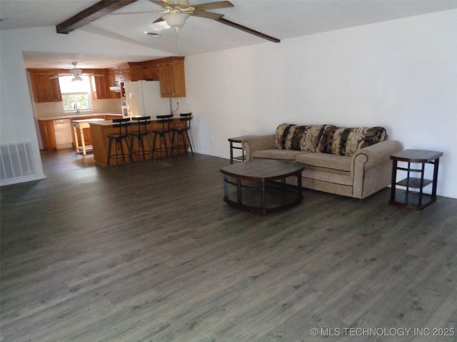 177 Lakeaire Dr, Eufaula, OK 74432 - living room with visible vents, dark wood-type flooring, lofted ceiling with beams, and ceiling fan