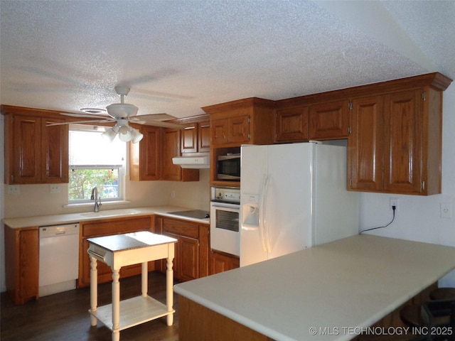 177 Lakeaire Dr, Eufaula, OK 74432 - kitchen with ceiling fan, a textured ceiling, a sink, light countertops, and white appliances