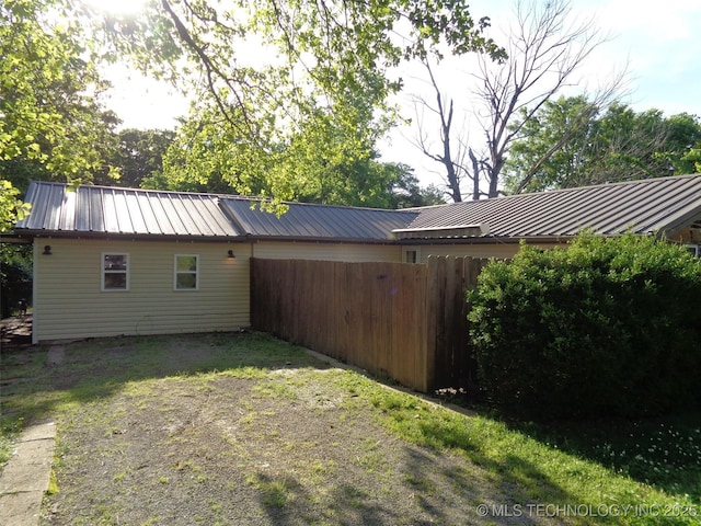 177 Lakeaire Dr, Eufaula, OK 74432 - view of home's exterior featuring fence, a standing seam roof, and metal roof