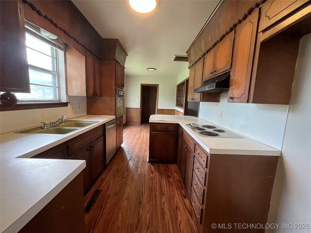12131 E 31st Pl, Tulsa, OK 74146 - kitchen with white electric stovetop, a sink, wall oven, under cabinet range hood, and light countertops