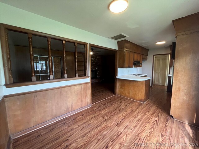 12131 E 31st Pl, Tulsa, OK 74146 - kitchen with wood finished floors and light countertops