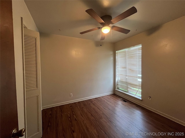 12131 E 31st Pl, Tulsa, OK 74146 - unfurnished bedroom featuring wood finished floors, baseboards, a closet, and ceiling fan