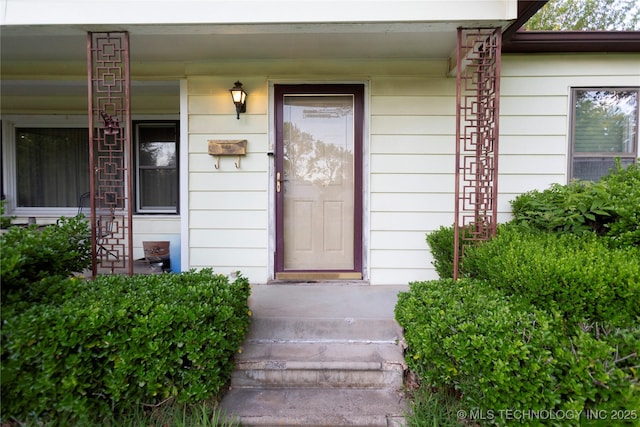 property entrance featuring covered porch