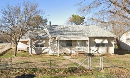 view of front of home with fence