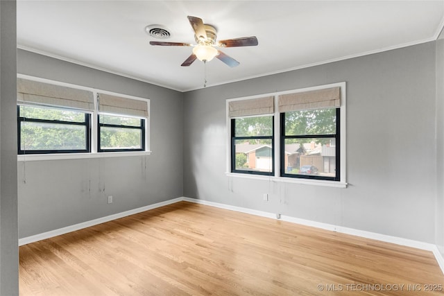unfurnished room featuring baseboards, ceiling fan, ornamental molding, and light wood finished floors