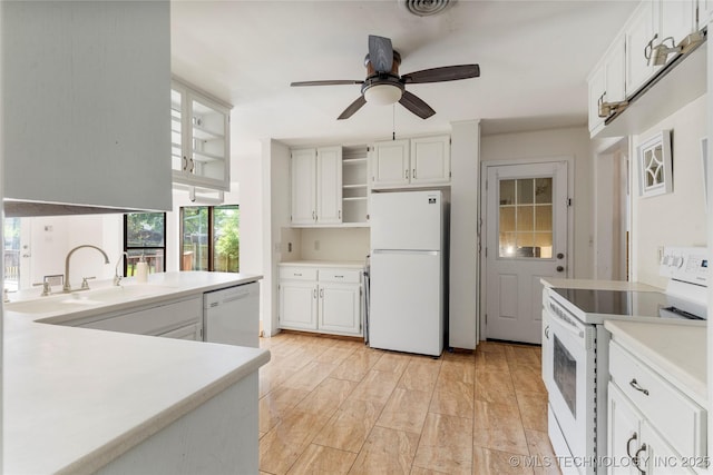 kitchen with open shelves, ceiling fan, a sink, white appliances, and white cabinetry