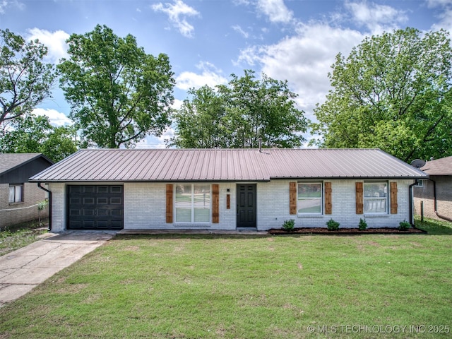 ranch-style house featuring an attached garage, a front yard, driveway, and brick siding