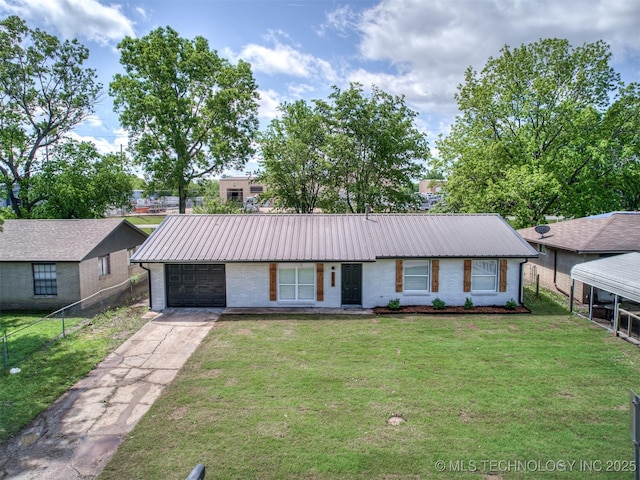 view of front of property with fence, brick siding, metal roof, an attached garage, and driveway