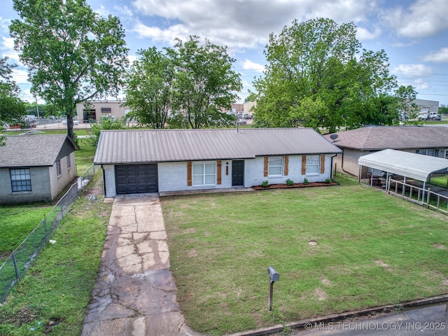 view of front facade with a front lawn, fence, brick siding, metal roof, and driveway