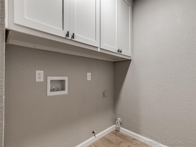 laundry room with hookup for a gas dryer, baseboards, washer hookup, cabinet space, and hookup for an electric dryer