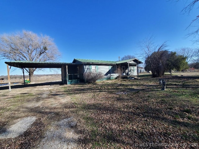 824 W Houston St, Okemah, OK 74859 - view of front of home featuring a carport
