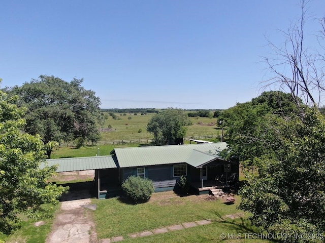 824 W Houston St, Okemah, OK 74859 - view of front of property featuring metal roof and a front lawn