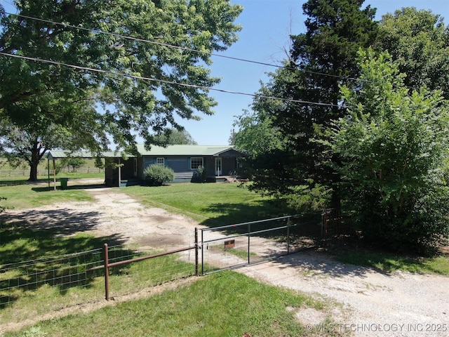 824 W Houston St, Okemah, OK 74859 - view of front of home with a gate and dirt driveway