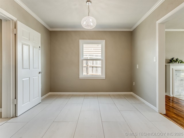2236 S Marion Ave, Tulsa, OK 74114 - unfurnished dining area featuring a chandelier, crown molding, and baseboards