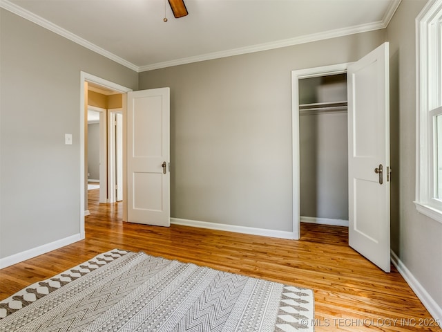 2236 S Marion Ave, Tulsa, OK 74114 - unfurnished bedroom with a closet, light wood-style flooring, baseboards, and ornamental molding