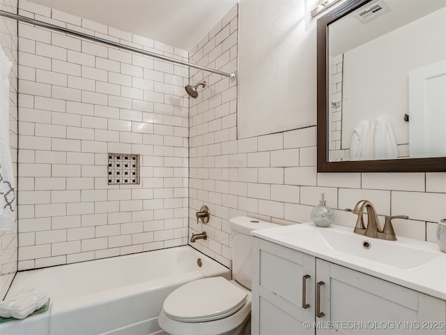 2236 S Marion Ave, Tulsa, OK 74114 - full bathroom featuring toilet,  shower combination, visible vents, decorative backsplash, and vanity