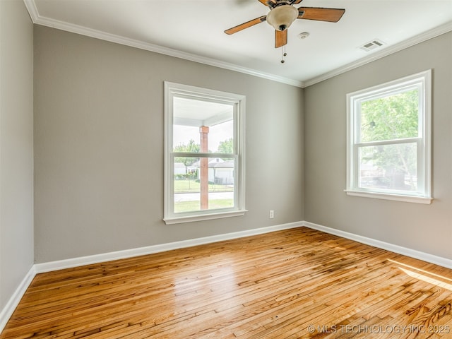 2236 S Marion Ave, Tulsa, OK 74114 - empty room with ornamental molding, hardwood / wood-style floors, and visible vents