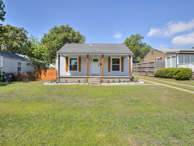 2236 S Marion Ave, Tulsa, OK 74114 - bungalow-style house featuring a porch, a front lawn, and fence