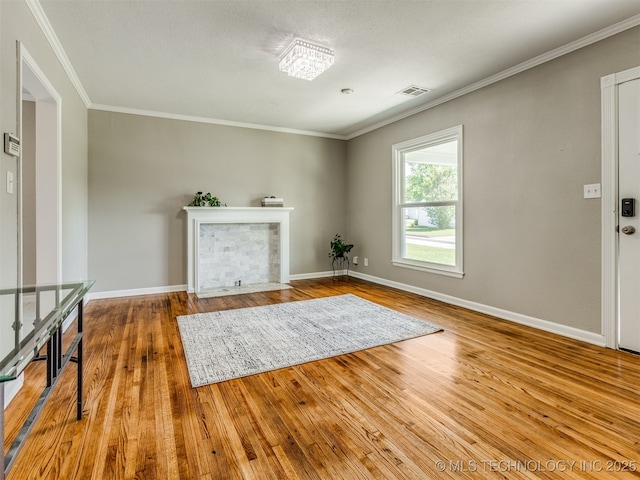 2236 S Marion Ave, Tulsa, OK 74114 - living area with crown molding, baseboards, visible vents, and wood finished floors