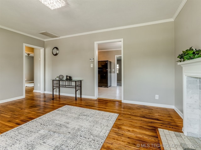 2236 S Marion Ave, Tulsa, OK 74114 - interior space featuring baseboards, crown molding, and wood finished floors