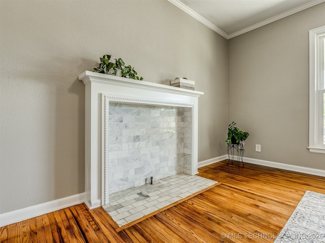 2236 S Marion Ave, Tulsa, OK 74114 - interior details with ornamental molding, baseboards, a fireplace with flush hearth, and wood finished floors