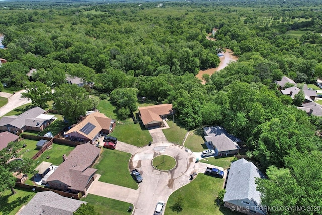 bird's eye view featuring a residential view and a view of trees