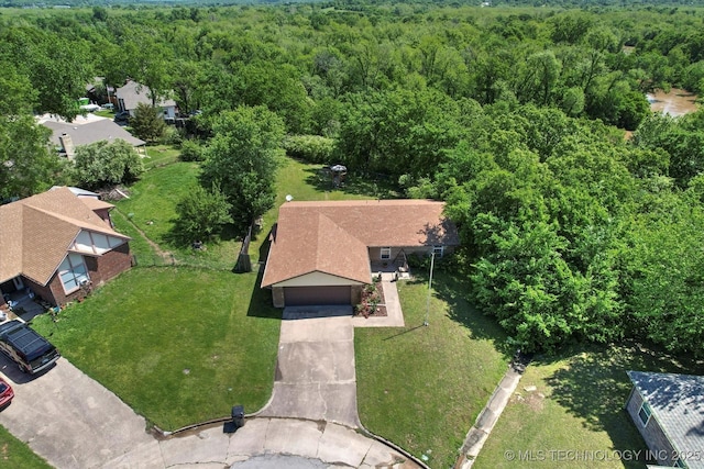 birds eye view of property with a wooded view
