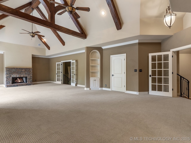 unfurnished living room featuring carpet floors, high vaulted ceiling, french doors, a ceiling fan, and baseboards