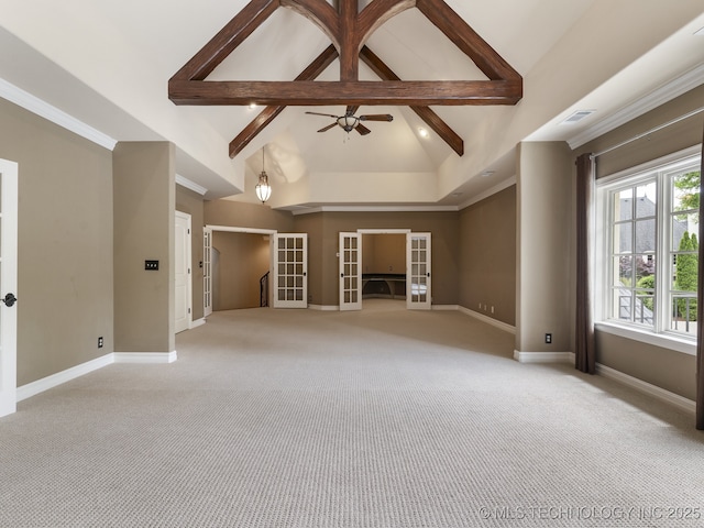 empty room featuring baseboards, light colored carpet, french doors, and beam ceiling