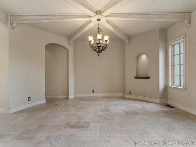 unfurnished room with an inviting chandelier, stone tile floors, baseboards, and beamed ceiling