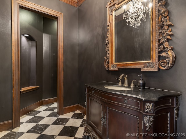 bathroom featuring tile patterned floors, baseboards, and vanity