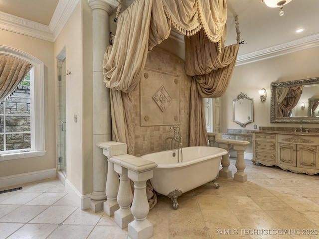 bathroom featuring crown molding, vanity, baseboards, a freestanding bath, and a shower stall